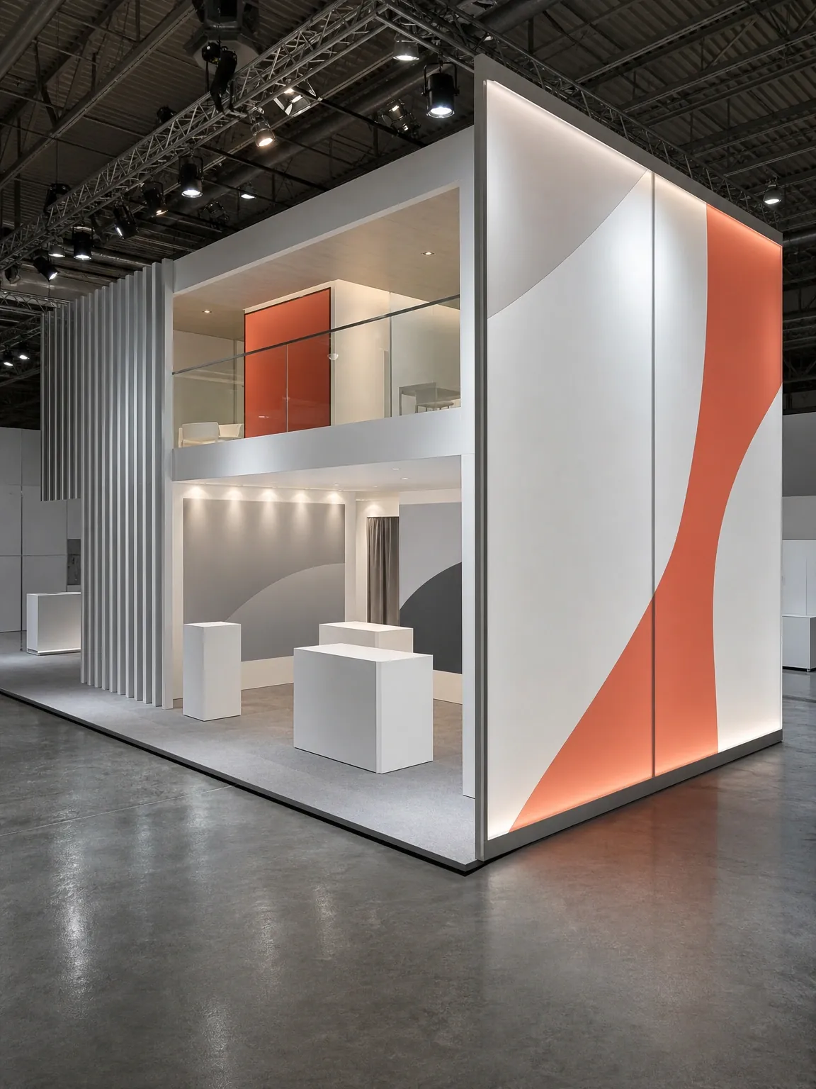 Double-height custom exhibition stand with backlit fabric panels on a trade-show floor